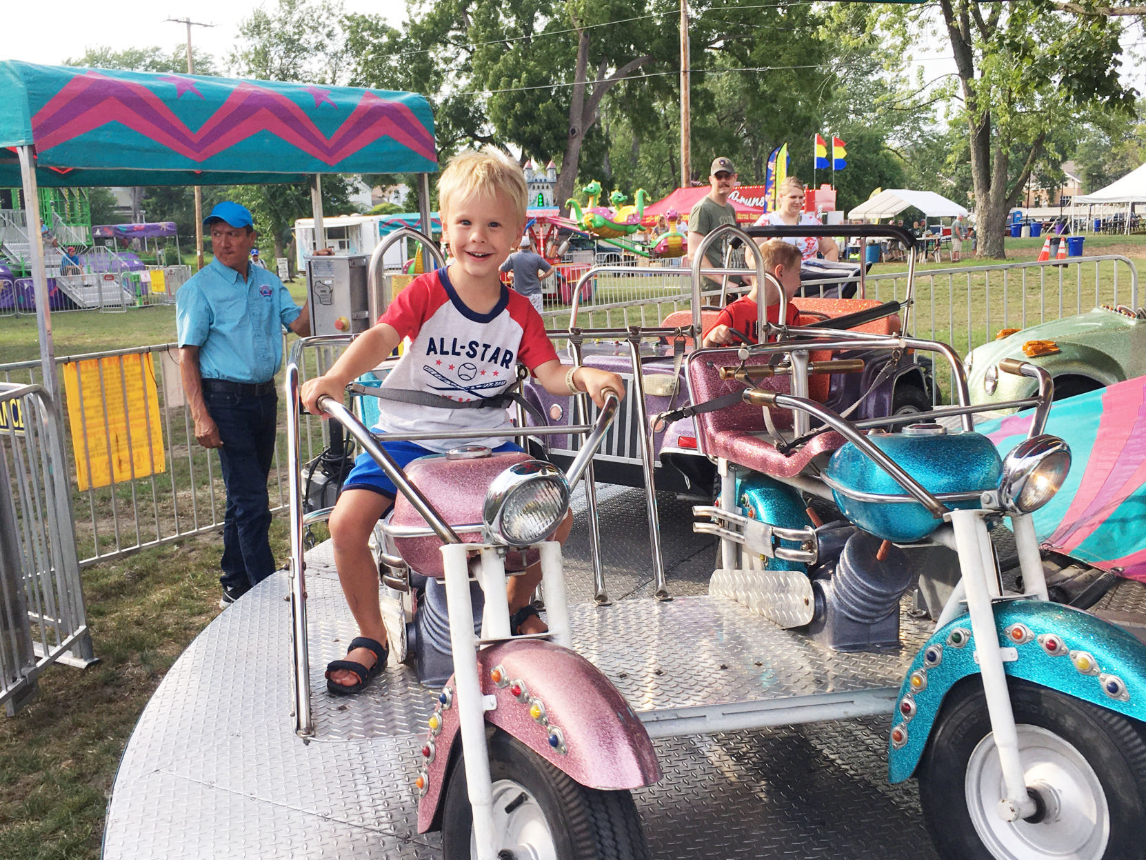 Raylan Wink, 4, rides a motorcycle carival ride at Lions Fun Fest